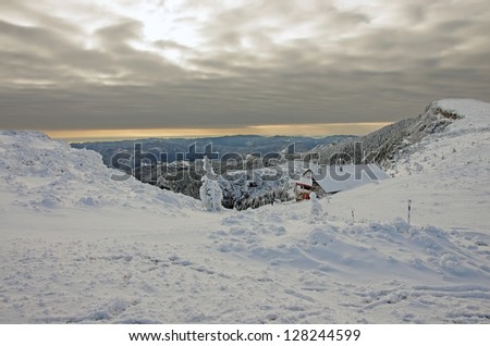 Winter landscape with shelter om Ceahlau mountain