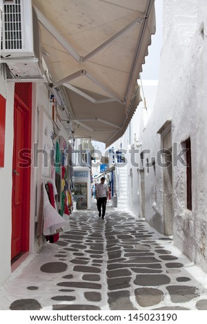 MYKONOS, GREECE- MAY 16:  Mykonos street with external colourful stairs of the houses and markets, Mykonos, Greece, on May 16, 2013.
