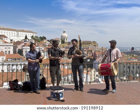 LISBON, PORTUGAL - MAY 06: Portuguese musicians are sing a song at Alfama Miradouro for tourists on May 06, 2014 in Lisbon.