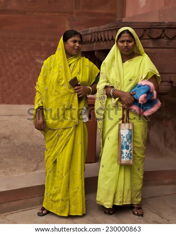Varanasi, India, November 17, 2010: Indian women at Varanasi streets in the India with the typical traditional colored dress.