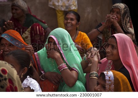 Delhi, India - 16 November, 2010: Traditional Indian women are in sari costume covered her head with veil, India