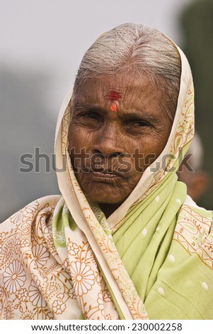 RAJASTHAN, INDIA- 17 November 2010: An Indian Rajasthani old lady walking on street with her traditional clothes, Rajasthan, India