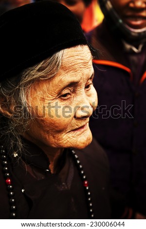 SAPA, VIETNAM - 24 March : Unidentified woman of Red Dao Ethnic Minority oldest People on March 24, 2011 in Sapa, Vietnam. Red Dao are the 9th largest ethnic group in Vietnam