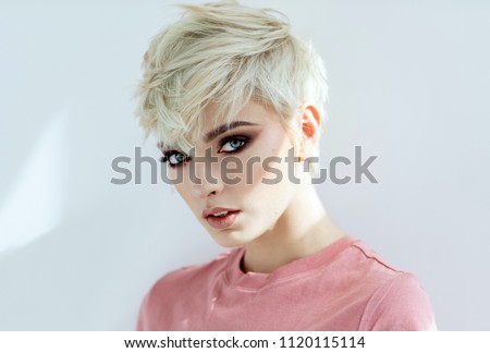 Beauty portrait of fashion blond model in messy short hair