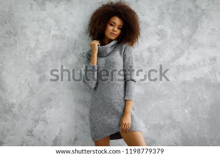 Young black woman wear high-neck wool and cashmere oversized sweater