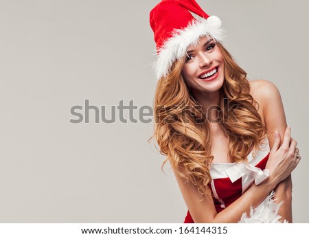 Smiling girl in santa clause costume