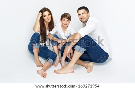 Young family wearing jeans and white shirt