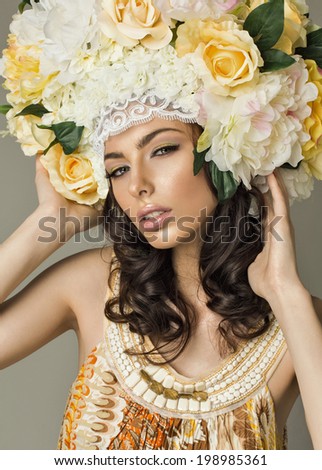 Studio portrait of gorgeous lady with flowers hair
