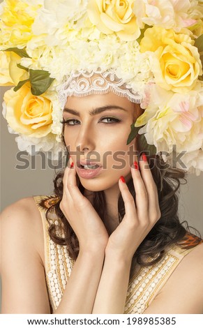Fashion beauty model with flowers hair. Perfect creative make up and hair style