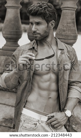 Black and white photo of fashion muscular man