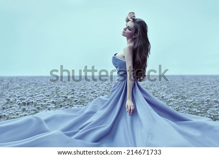 Beautiful woman wearing blue dress