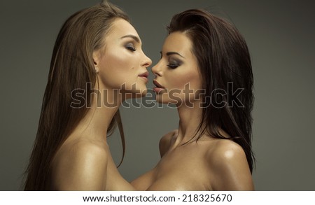 Two sexy women kissing each other