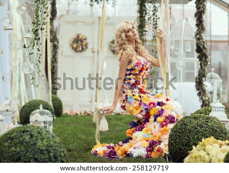 Fashion lady in spring scenery wearing flower dress
