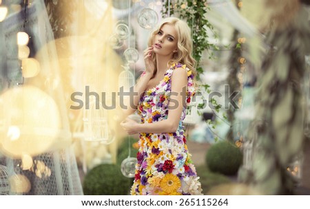 Beautiful woman in dress of flowers