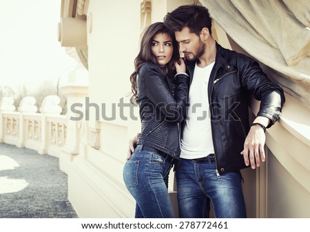 Sexy couple in leather jacket hugging each other
