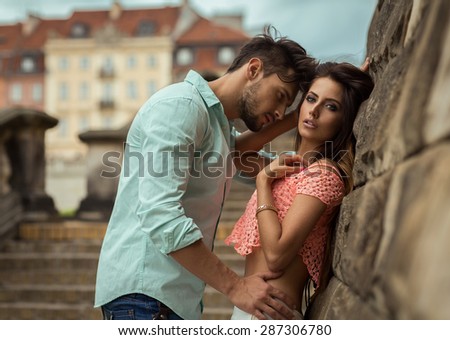 Attractive young couple touching each other