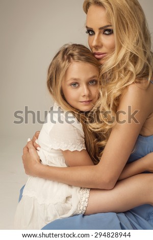 Beautiful mother and daughter hugging each other