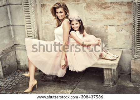 Mother and daughter in same outfits wearing tutu skirts