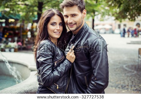 Portrait of attractive couple in leather jacket. Autumn photo