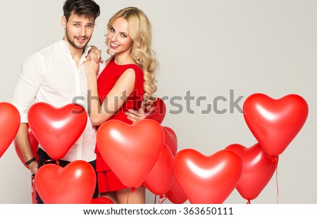 Portrait of cute couple with balloons heart