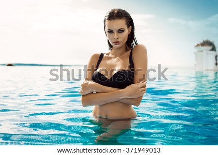 Sexy model wearing bikini in the pool