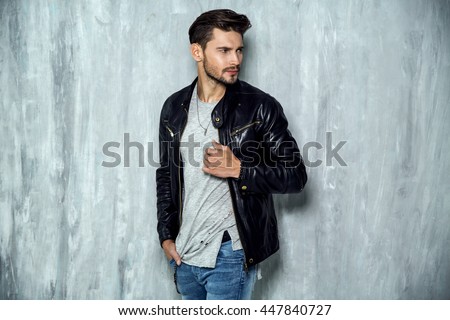 Photo of handsome man in black leather jacket