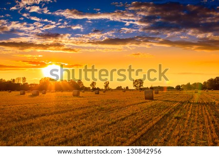 End of day over field with hay bale in Hungary- this photo made by HDR technic