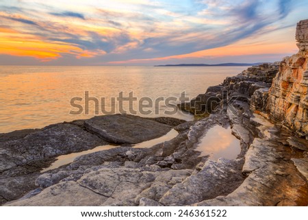 Beautiful rocks and sea. Sunrise over the sea near Rt Kamenjak, Croatia