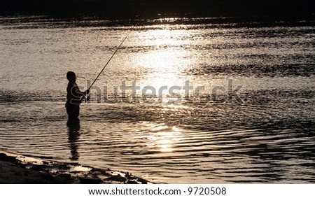 Fisherman silhouette catching fish