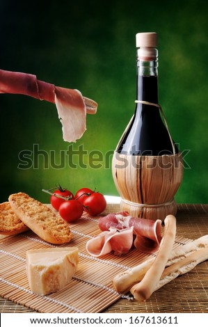 typical Italian snack with cheese and red wine