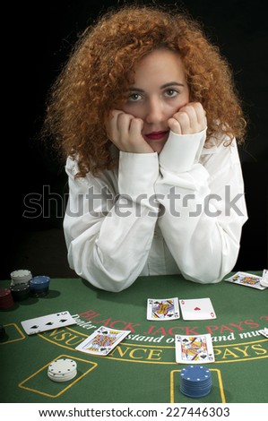 red-haired girl playing cards
