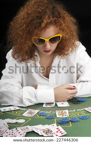 red-haired girl playing cards