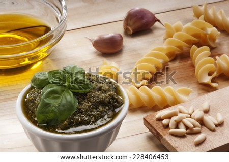 Ingredients for preparing a Genovese pesto with fresh basil, olive oil, garlic and pine nuts