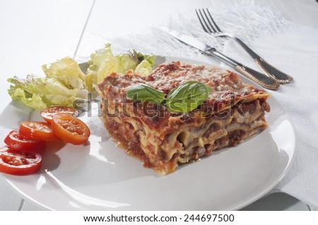 lasagna is a typical Italian meal, made with fresh pasta baked with meat sauce and bechamel sauce