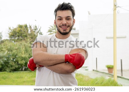 portrait of young athletic male model laughing after sport time
