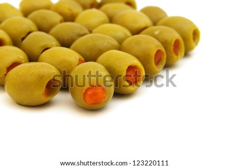 bunch of stuffed green olives on a white background