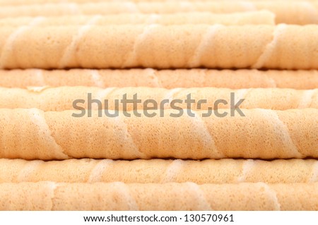 Close-up of striped wafer rolls