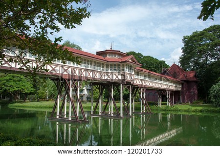 Teak wood corridor corss the pool at Sanamchandra Palace Thailand