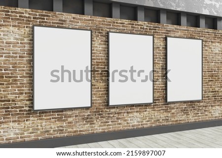 Clean white banners hanging on brick outdoor wall with shadows and sunlight. Billboard, commercial and advertisement concept. 3D Rendering