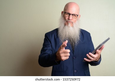 Happy Mature Bearded Bald Businessman Talking Stock Photo