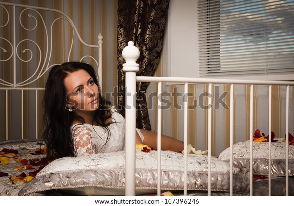 Attractive Brunette Lying On Bed Boudoir Stock Photo Edit Now