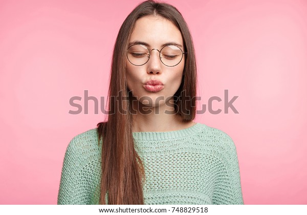 Attractive Female Model Closes Eyes