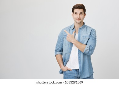 Attractive Mature Man Pointing Index Finger Stock Photo