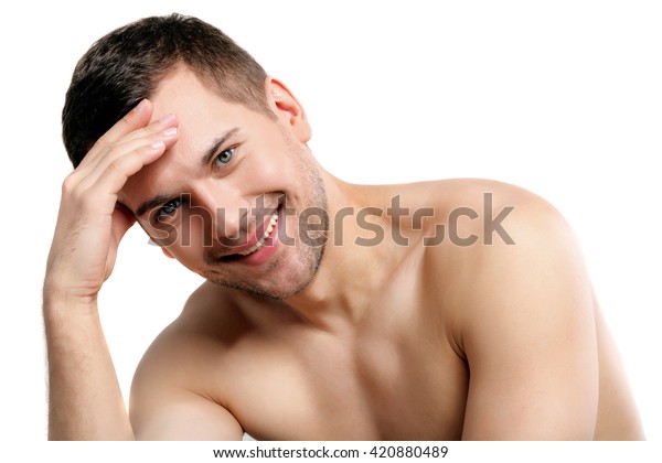 Attractive Naked Man Evincing His Shame Stock Photo