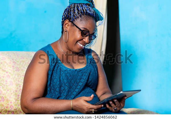 Beautiful African Mature Woman Wearing Blue Stock Photo