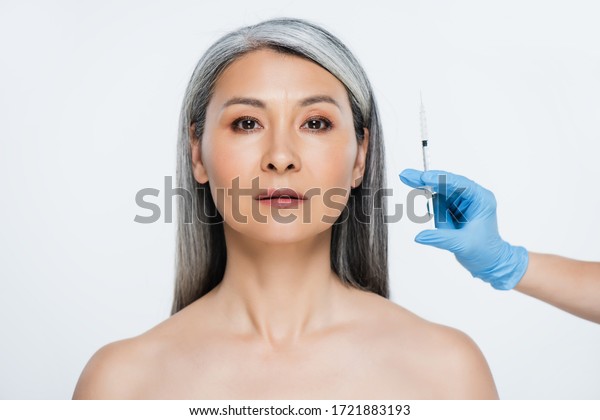 Beautiful Naked Asian Woman And Doctor In Latex Gloves Holding Syringe