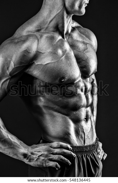 Beautiful Naked Male Torso Against Black Stock Photo