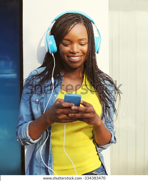 Beautiful Smiling African Woman Headphones Listens Stock Photo