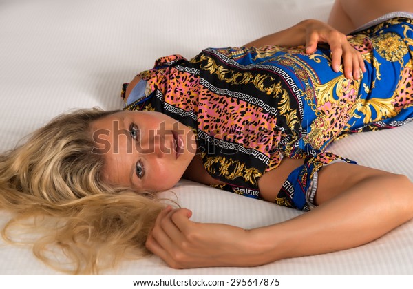 Beautiful Statuesque Blonde Woman Colorful Print Stock Photo