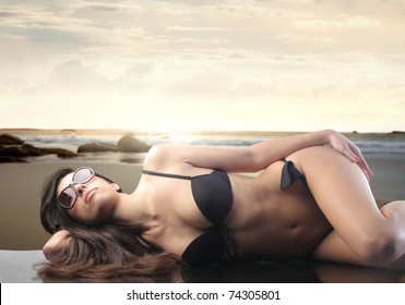 Woman Wearing Bikini Reclining On Rocks库存照片46843357 Shutterstock